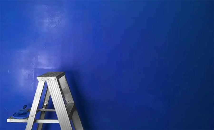 You can paint a wall either blue or green and use it as a blue or green screen
