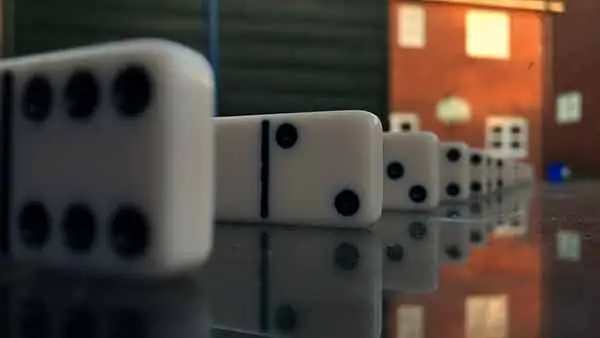 Demonstrating depth of field with iPhone using dominoes. The iPhone camera is focused on a domino 4 inches away, producing a narrow depth of field. Consequently the background is very blurry.