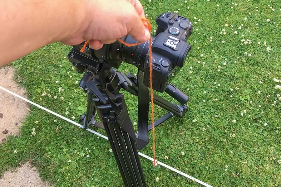 Using a plumb line to find the position of the camera's focal plane over the tape measure