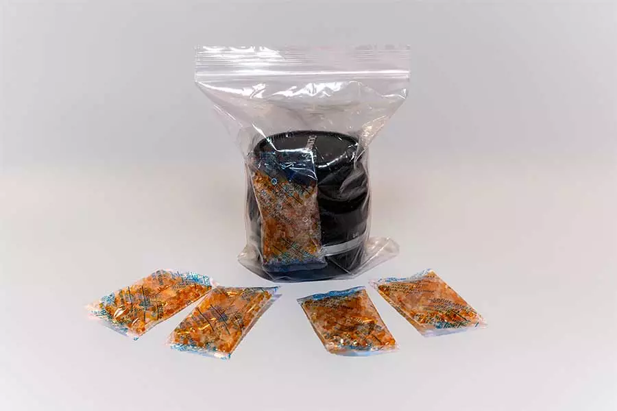 Lens-in-zip-lock-bag-and-a-packet-of-desiccant