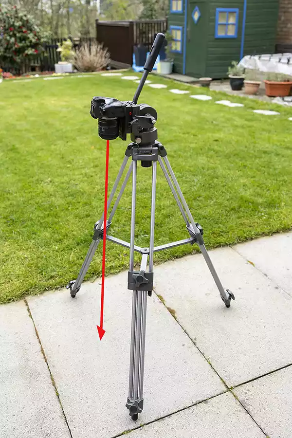 Tripod with camera tilted down toward the ground