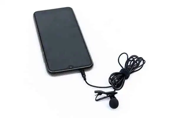 Lapel mic with 3.5mm TRRS jack plugged into smartphone headphone socket