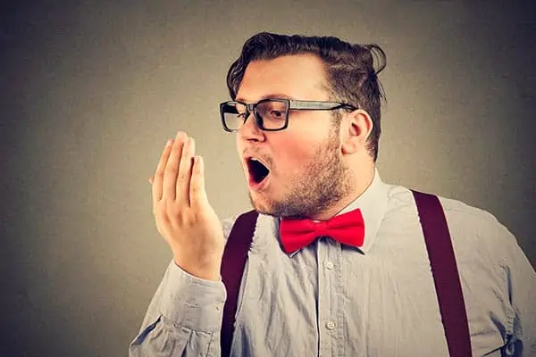 Man feeling the blast of a plosive on the palm of his hand