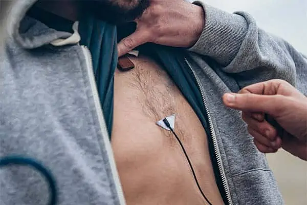 Lavalier microphone attach to chest skin with a tape triangle