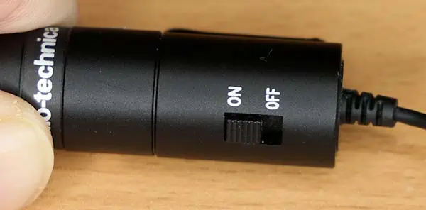 The power switch on the battery compartment of a Audio Technica ATR3350 with the switch in the ON position